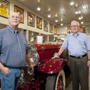 Michael Pratt stands with Jim Rogers among the massive amount of cars in Rogers’ collection Tuesday, Sept. 20, 2011. Pratt is director of transportation for Rogers’ collection and has been responsible for tracking down a majority of the vehicles.